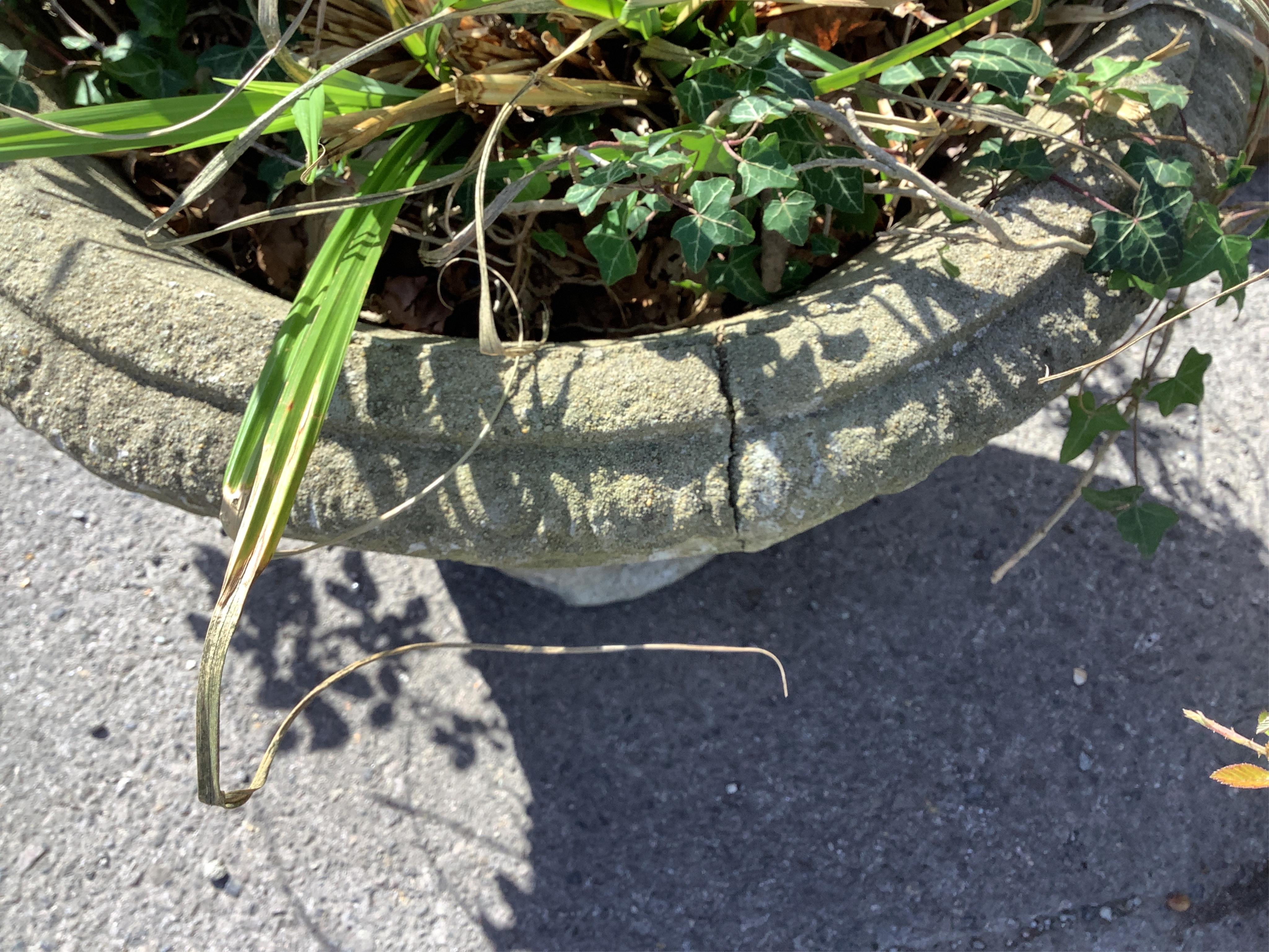 A pair of reconstituted stone garden planters, diameter 60cm, height 48cm